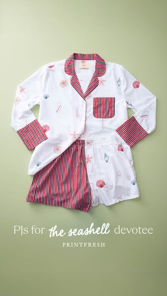An image ad showcasing a set of Printfresh brand women's pajamas, styled as a flat lay and designed for people who a