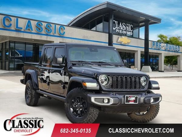This is an image ad from a car dealership promoting a black Jeep Gladiator. The dealership's logo and contact inform