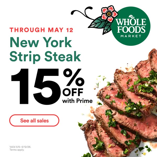 An advertisement promoting a 15% discount on New York Strip Steak at Whole Foods Market for Amazon Prime members. The ad