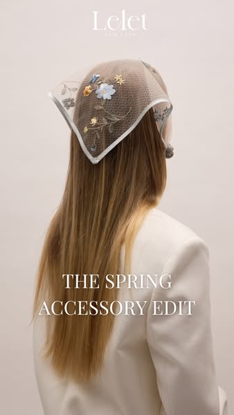 This image ad features a woman from the back wearing a spring accessory, specifically a square head scarf with floral em