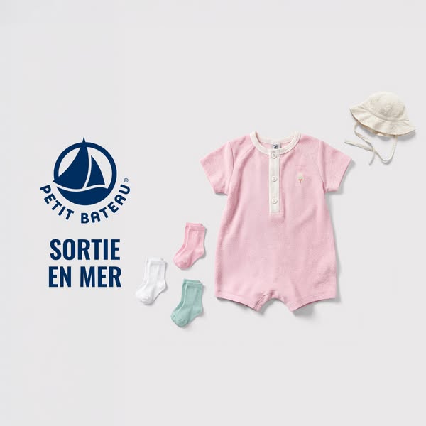 This ad features a collection of baby clothing, including a pink romper, socks, and a hat, promoting Petit Bateau's 