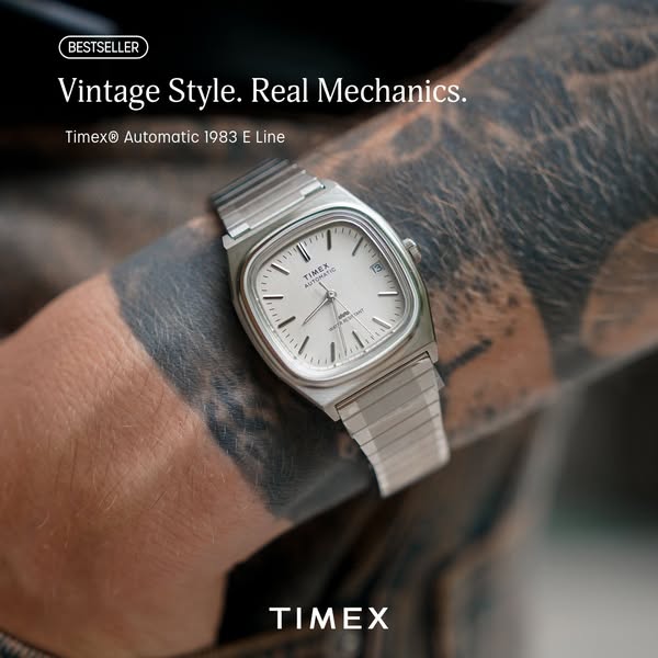 This is a product image ad showing the Timex Automatic 1983 E Line watch on a person's wrist.