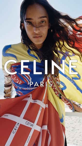 A high-fashion ad for Celine. An unknown model poses on a beach wearing a colorful silk scarf.