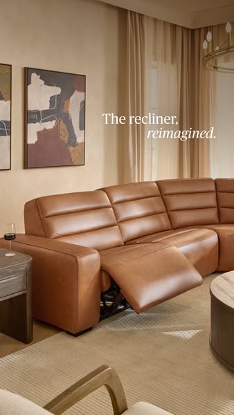 This ad presents a luxurious, modern recliner sofa, emphasizing its design and comfort through a stylish interior settin
