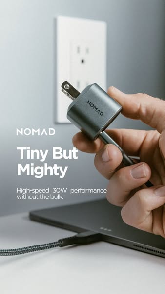 This ad showcases the Nomad USB-C Power Adapter, highlighting its compact size and 30W charging capability. The ad uses 