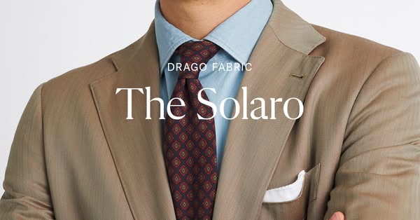 The ad showcases a Drago fabric suit and tie ensemble. It is a simple product shot with messaging intended to highlight 