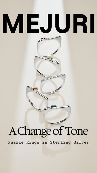 This ad features multiple silver Mejuri puzzle rings each with a different colored gem. The ad uses a simple studio prod