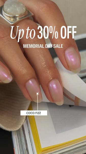 An image ad featuring a hand wearing a large ring with pearlescent pink nail polish. The ad promotes a Memorial Day sale