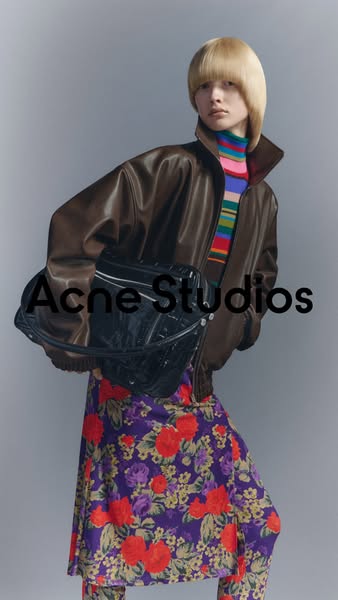This ad features a person wearing a brown leather jacket, a colorful striped turtleneck, a floral skirt and pants, and c