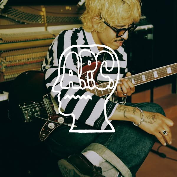 A musician is playing guitar, and a white illustrated logo featuring a head and the letters ABC is superimposed over the