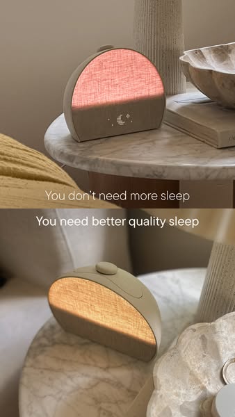The image ad for a sleep product displays two different colors of the product light on a nightstand while presenting the