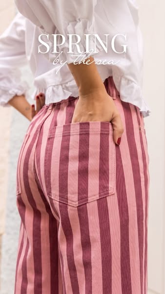 This ad features a close-up shot of a person wearing pink and maroon striped pants. The text overlay reads "SPRING 