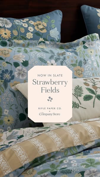 This ad showcases bedding and home goods from Rifle Paper Co. x The Company Store's new 'Strawberry Fields' 