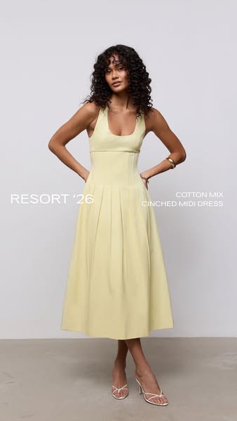 A simple ad showcasing a single product: a yellow 'cotton mix cinched midi dress'.