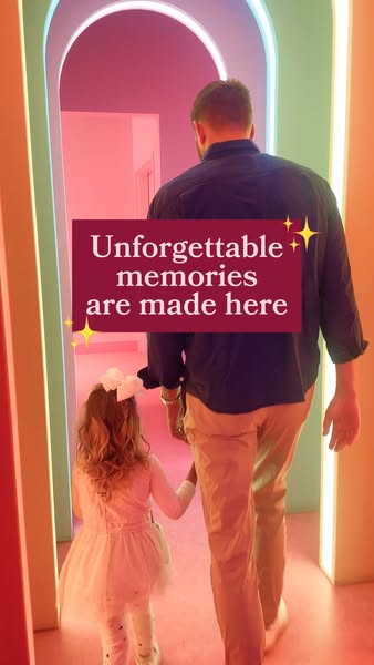 This image ad shows a man and a child walking through a colorful archway with text overlay, "Unforgettable memories