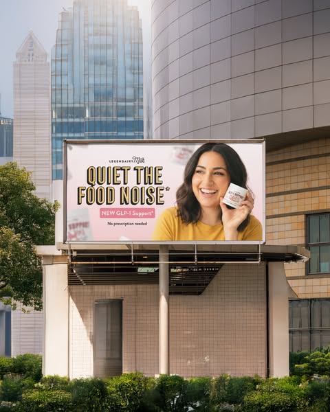 This ad features a billboard promoting Legendairy Milk's new GLP-1 Support supplement, designed to help quiet food n