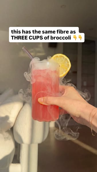 An image ad promoting a beverage that contains as much fiber as three cups of broccoli. The drink is held by a person. T