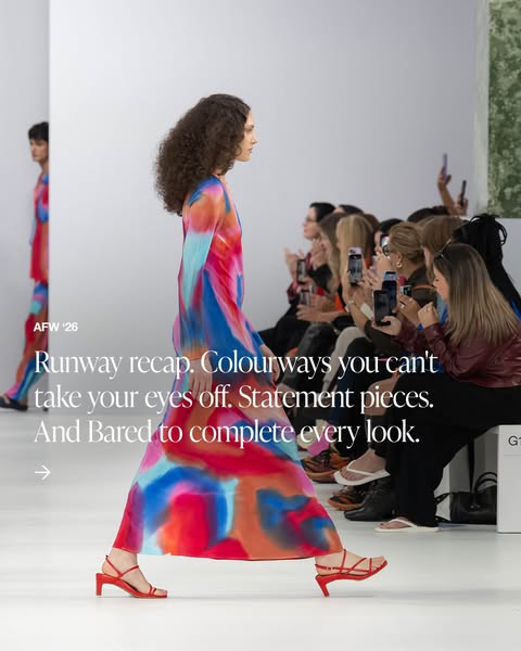 This ad showcases a runway fashion show featuring a model wearing a colorful dress and red heeled sandals. The ad promot