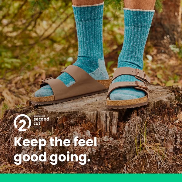 This image ad promotes Smartwool socks with the message that they are comfortable. The product is shown being worn with 