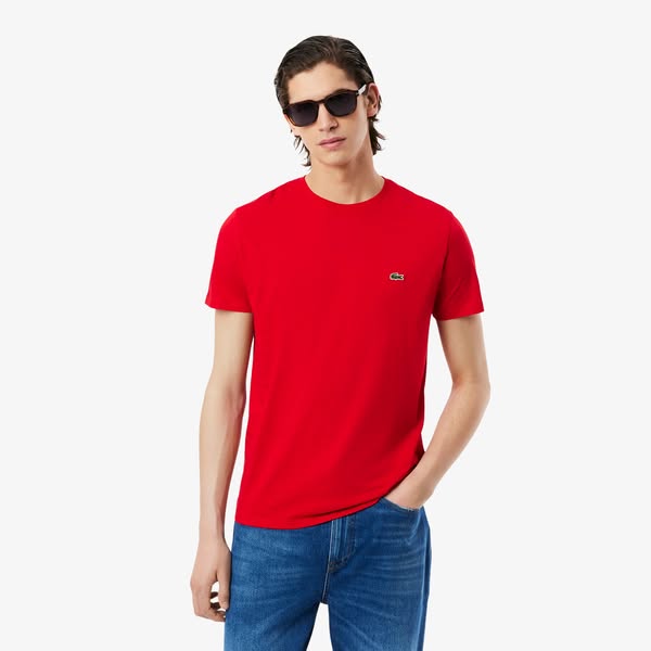 This ad features a man wearing a red Lacoste t-shirt and blue jeans against a white background. The ad is likely intende
