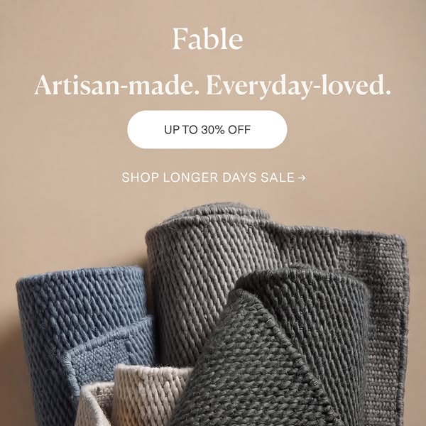 This ad for Fable features a close-up of several rolled rugs in neutral colors. Text highlights the brand, its focus on 