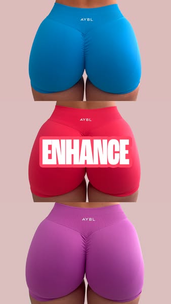 This ad showcases three pairs of AYBL shorts in blue, pink and purple with the word 'ENHANCE' in a white box ove