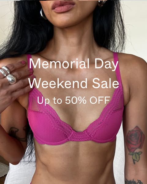 This ad features a woman wearing a pink bra. The ad announces a Memorial Day Weekend Sale with up to 50% off.