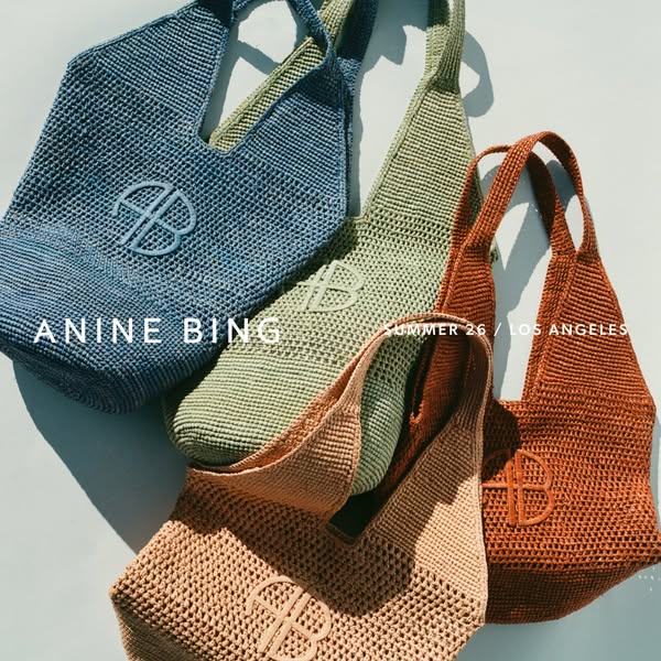 An image ad for Anine Bing’s Summer 26 collection showcasing a variety of colorful crocheted tote bags.