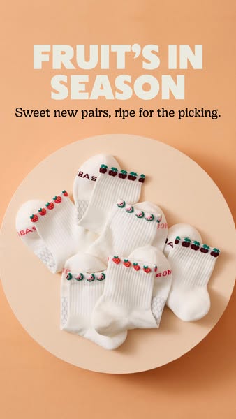 This ad features a collection of Bombas ankle socks with fruit designs on a peach colored background. The ad's headl