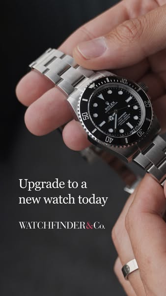 An image ad featuring a close-up of a Rolex watch being held up to the camera. Text encourages viewers to upgrade their 