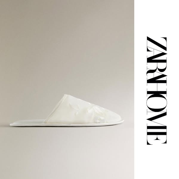 This ad showcases a single white slipper from Zara Home against a neutral background. The brand logo is prominently disp