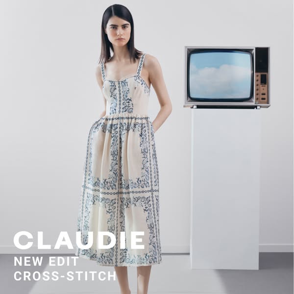 This ad features a woman wearing a dress and standing in front of a television on a pedestal.