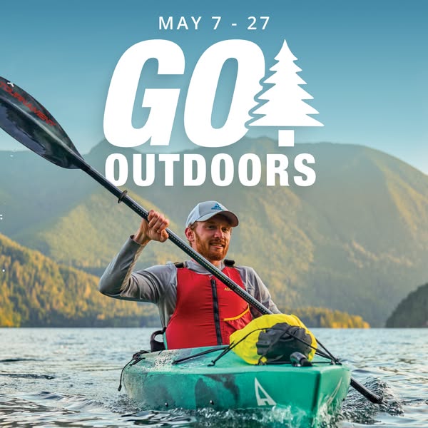 This ad features a man kayaking on a lake with mountains in the background. The ad is for an event that takes place from