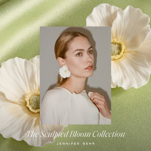 This ad showcases Jennifer Behr's Sculpted Bloom Collection by featuring a model wearing the floral earrings from th