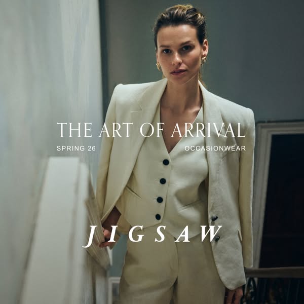 This ad features a woman in occasion wear from Jigsaw. The ad's focal point is on a woman walking down the stairs, p