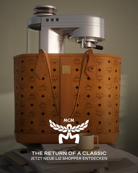 This ad showcases an MCM Liz shopper tote bag in a lifestyle setting with a high-end coffee maker on top of the bag and 