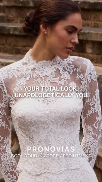 This ad promotes Pronovias bridal wear. The image showcases a woman in a white lace dress, inviting viewers to book an i
