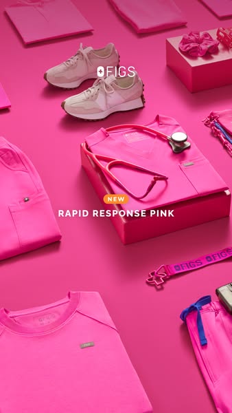 A flatlay-style image showcasing various FIGS products, highlighting the new "Rapid Response Pink" color. The 