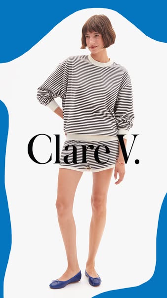 This is an image ad for Clare V. featuring a woman modeling a striped sweatshirt and shorts set with blue ballet flats.