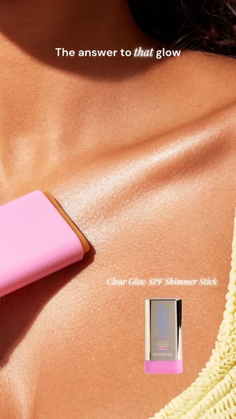 This image shows the Clear Glow SPF Shimmer Stick being applied to a woman's chest, highlighting the resulting glow.
