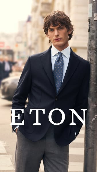 This ad showcases a suited man in an urban street setting, promoting the brand ETON with an aspirational lifestyle.