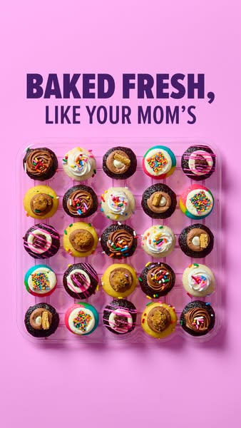 This is an overhead studio shot of a package of mini cupcakes against a light pink background, with the headline text &q