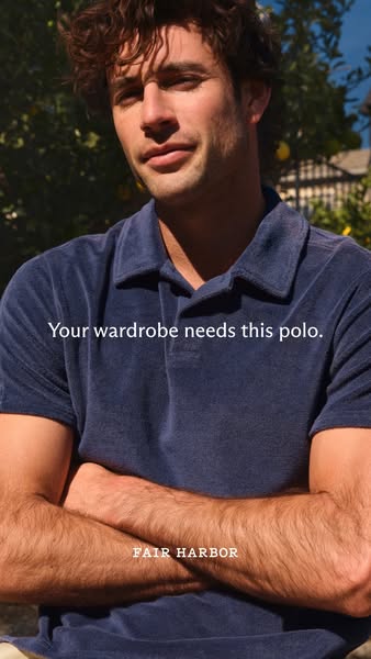 This ad features a handsome man wearing a soft, navy blue Fair Harbor polo shirt. The brand is subtly promoted as a ward