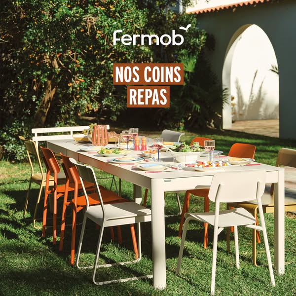 This ad showcases Fermob outdoor furniture in a setting for outdoor dining.