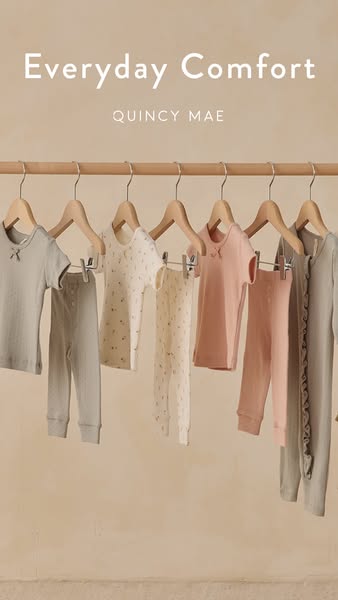 This ad showcases Quincy Mae clothing. The ad displays the apparel on a clothing rack with the brand name and callout to