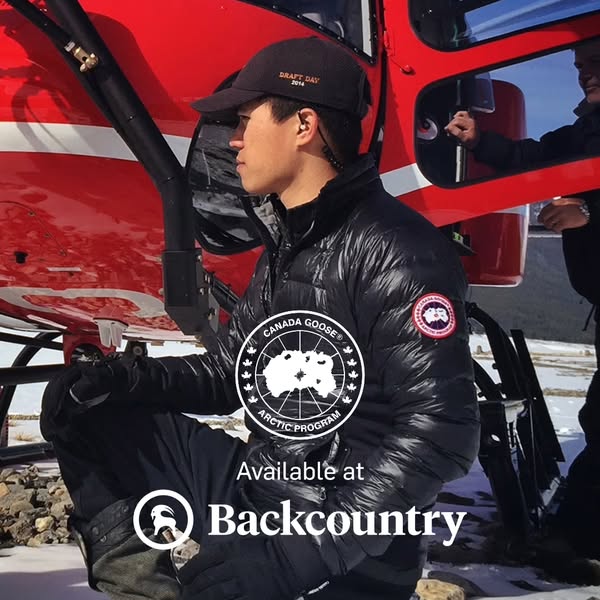 This ad features a man wearing a Canada Goose jacket while standing next to a red helicopter. The ad promotes Canada Goo