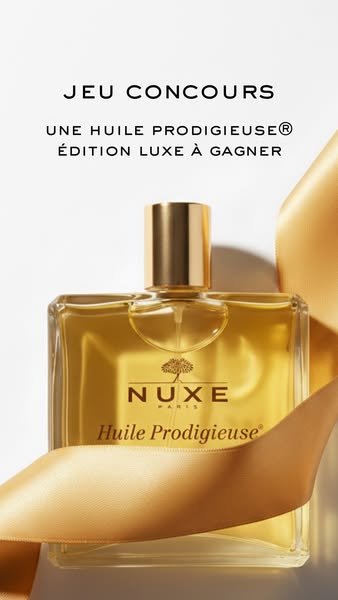 This image ad showcases Nuxe's Huile Prodigieuse® Édition Luxe. The ad invites the audience to participate in a give