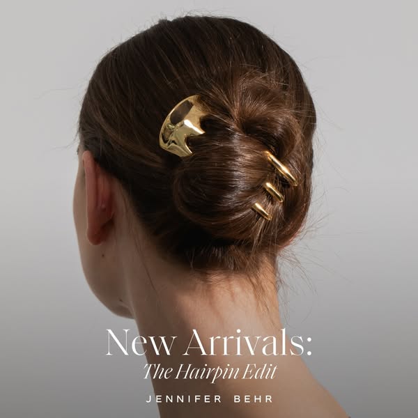 This ad showcases a new hairpin from Jennifer Behr. The image features the back of a woman's head, highlighting the
