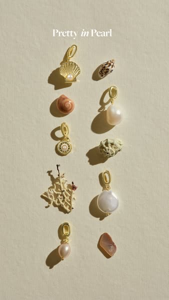 This image ad features a flatlay of pearl jewelry, showcasing different pendants arranged artfully alongside natural she