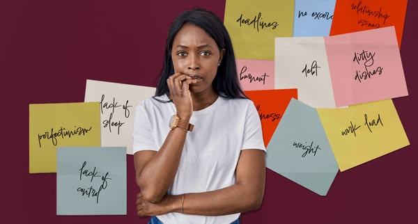 An ad showing a woman surrounded by sticky notes to show the user's pain points.